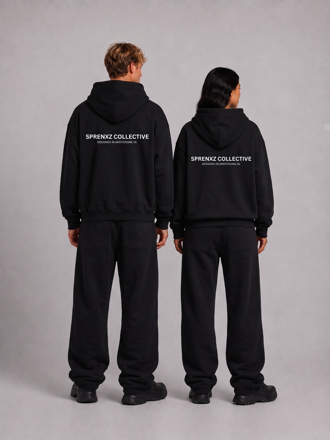 Sprenxz Collective tracksuit zwart/wit gedragen door modellen - achterkant